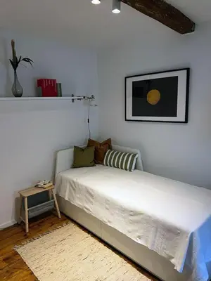 Ein Bett oder Betten in einem Zimmer der Unterkunft Charmantes Häuschen am Waldrand