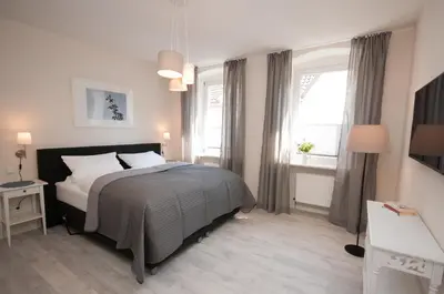 Ein Bett oder Betten in einem Zimmer der Unterkunft Bärengasse Apartments