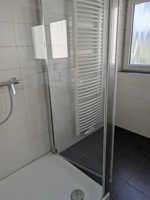Ein Badezimmer in der Unterkunft Ferienhaus Rauwolf mit 2 Ferienwohnungen