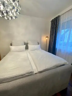 Ein Bett oder Betten in einem Zimmer der Unterkunft Ferienwohnung
