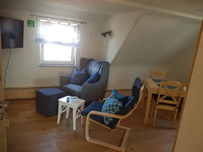 Ein Sitzbereich in der Unterkunft Ferienwohnungen Lamm Spiegelberg-Jux