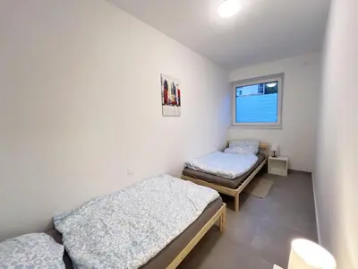 Ein Bett oder Betten in einem Zimmer der Unterkunft Modern and Cozy Apartment in Heilbronn