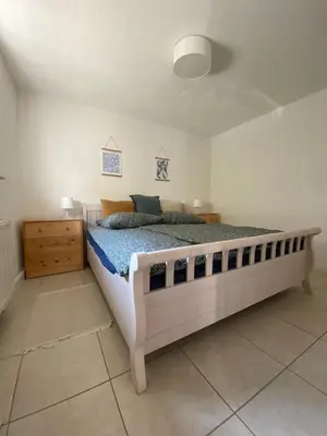 Ein Bett oder Betten in einem Zimmer der Unterkunft Ferienwohnung am Hainbach