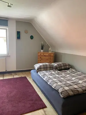 Ein Bett oder Betten in einem Zimmer der Unterkunft FERIENHAUS ZUM BULLERJAN - Coozy Haus mit Kamin
