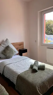 Ein Bett oder Betten in einem Zimmer der Unterkunft Villa Mediterrane - Apartment Milan