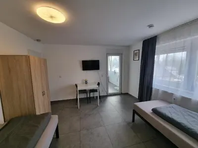Ein Bett oder Betten in einem Zimmer der Unterkunft Residence Apartments