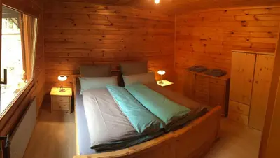 Ein Bett oder Betten in einem Zimmer der Unterkunft Chalet Eins
