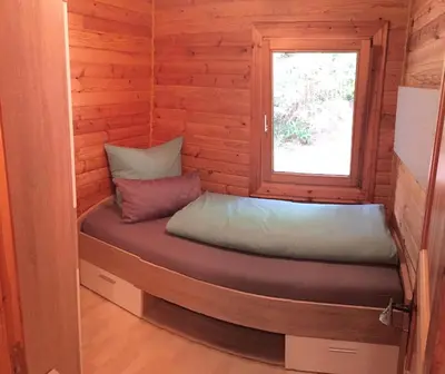 Ein Bett oder Betten in einem Zimmer der Unterkunft Chalet Eins