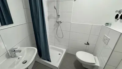 Ein Badezimmer in der Unterkunft Böhl Station 1 Zimmer-Wohnungen