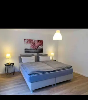 Ein Bett oder Betten in einem Zimmer der Unterkunft Sufo Apartment