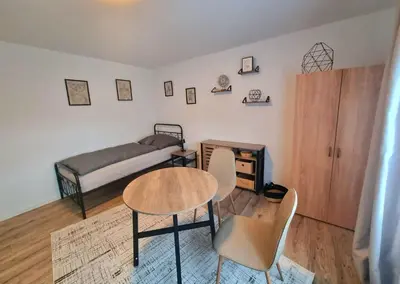 Ein Bett oder Betten in einem Zimmer der Unterkunft Residence Apartments