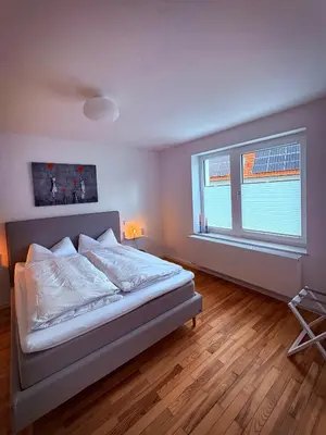 Ein Bett oder Betten in einem Zimmer der Unterkunft Rebenglück in Göcklingen