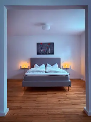 Ein Bett oder Betten in einem Zimmer der Unterkunft Rebenglück in Göcklingen
