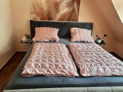 Ein Bett oder Betten in einem Zimmer der Unterkunft NEU! Ferienwohnung Unterfranken