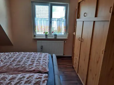 Ein Bett oder Betten in einem Zimmer der Unterkunft NEU! Ferienwohnung Unterfranken