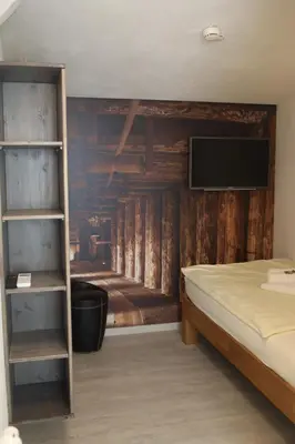 Ein Bett oder Betten in einem Zimmer der Unterkunft Hotel Duwakschopp