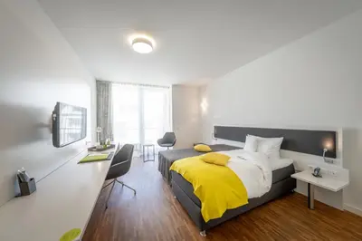 Ein Bett oder Betten in einem Zimmer der Unterkunft Gästehaus am Schloss