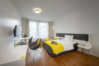 Ein Bett oder Betten in einem Zimmer der Unterkunft Gästehaus am Schloss