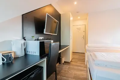 TV/Unterhaltungsangebot in der Unterkunft Nine Rooms - Serviced Rooms