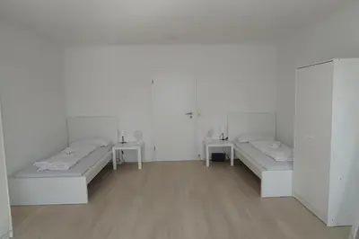 Ein Bett oder Betten in einem Zimmer der Unterkunft Monteurwohnung L6 - Apartment 09
