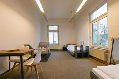 Ein Bett oder Betten in einem Zimmer der Unterkunft G-Living Wilhelmstraße
