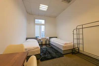 Ein Bett oder Betten in einem Zimmer der Unterkunft G-Living Wilhelmstraße