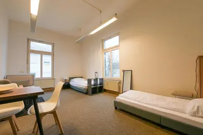 Ein Bett oder Betten in einem Zimmer der Unterkunft G-Living Wilhelmstraße