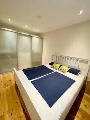 Ein Bett oder Betten in einem Zimmer der Unterkunft Moderne gemütliche Wohnung - zentral und naturnah