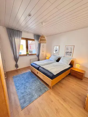 Ein Bett oder Betten in einem Zimmer der Unterkunft Ferienwohnung in Lorsch mit Garten