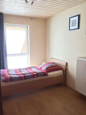 Ein Bett oder Betten in einem Zimmer der Unterkunft Ferienhaus in Reilingen