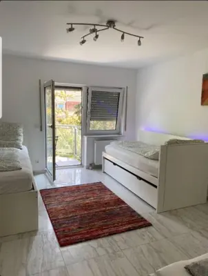 Ein Bett oder Betten in einem Zimmer der Unterkunft Gemütliche Wohnung im Herzen von Heidelberg