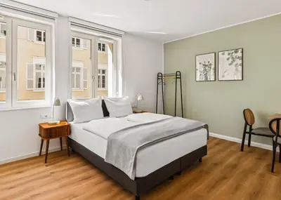 Ein Bett oder Betten in einem Zimmer der Unterkunft Limehome Karlsruhe Kaiserstraße