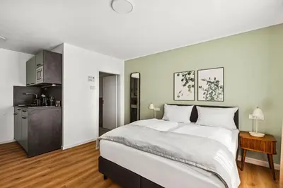 Ein Bett oder Betten in einem Zimmer der Unterkunft Limehome Karlsruhe Kaiserstraße