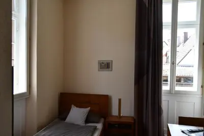 Ein Bett oder Betten in einem Zimmer der Unterkunft Gästehaus stuttgART36
