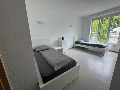 Ein Bett oder Betten in einem Zimmer der Unterkunft R&R Apartments - Boardinghouse