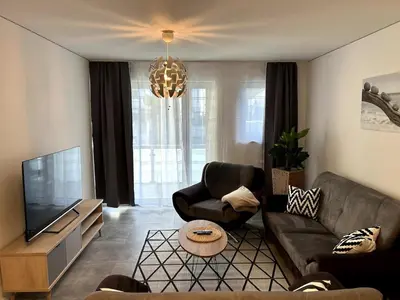 TV/Unterhaltungsangebot in der Unterkunft Nur 9 Min zu Fuß ins Zentrum I Balkon I Netflix