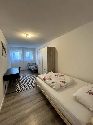 Ein Bett oder Betten in einem Zimmer der Unterkunft Nur 9 Min zu Fuß ins Zentrum I Balkon I Netflix