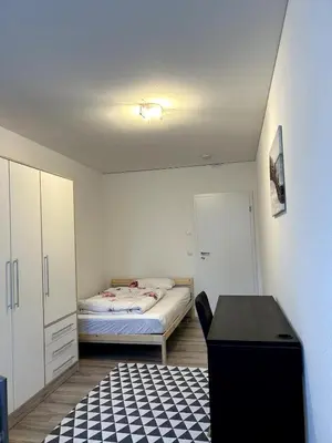 Ein Bett oder Betten in einem Zimmer der Unterkunft Nur 9 Min zu Fuß ins Zentrum I Balkon I Netflix