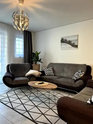 Ein Sitzbereich in der Unterkunft Nur 9 Min zu Fuß ins Zentrum I Balkon I Netflix