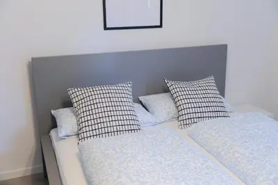 Ein Bett oder Betten in einem Zimmer der Unterkunft Untergeschoss mit Stil modern, ruhig & mit Terrasse