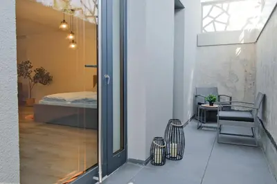 Ein Bett oder Betten in einem Zimmer der Unterkunft Untergeschoss mit Stil modern, ruhig & mit Terrasse