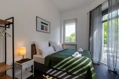 Ein Bett oder Betten in einem Zimmer der Unterkunft Zentral gelegenes 3 Schlafzimmer - Apartment mit Einzelbetten bis 7 Personen