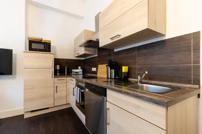 Küche/Küchenzeile in der Unterkunft Zentral gelegenes 3 Schlafzimmer - Apartment mit Einzelbetten bis 7 Personen