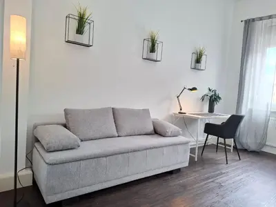 Ein Sitzbereich in der Unterkunft Zentral gelegenes 3 Schlafzimmer - Apartment mit Einzelbetten bis 7 Personen