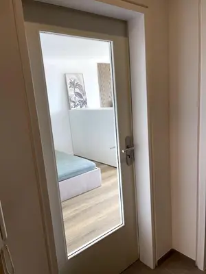 Ein Bett oder Betten in einem Zimmer der Unterkunft City Loft mit Balkonblick