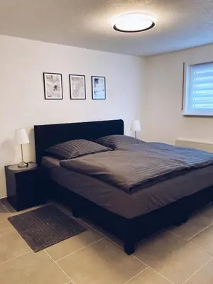 Ein Bett oder Betten in einem Zimmer der Unterkunft Ferienwohnung Elena