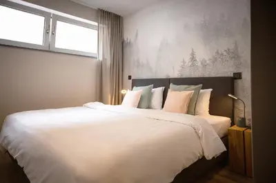 Ein Bett oder Betten in einem Zimmer der Unterkunft stuub karlsruhe