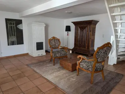 Ein Sitzbereich in der Unterkunft Ferienhaus Lisette Wohlfühldomizil zwischen Rebenmeer und Pfälzer Wald