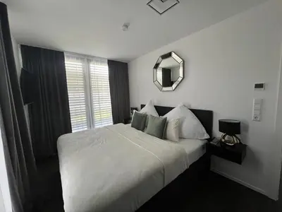Ein Bett oder Betten in einem Zimmer der Unterkunft Karlsruhe Finest Apartments