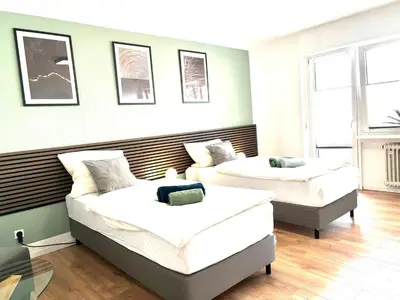 Ein Bett oder Betten in einem Zimmer der Unterkunft CityapartmentWorms, urbaner Rückzugsort